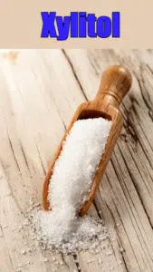 xylitol birch sugar in wooden scoop