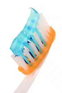 A nurdle of toothpaste on a toothbrush